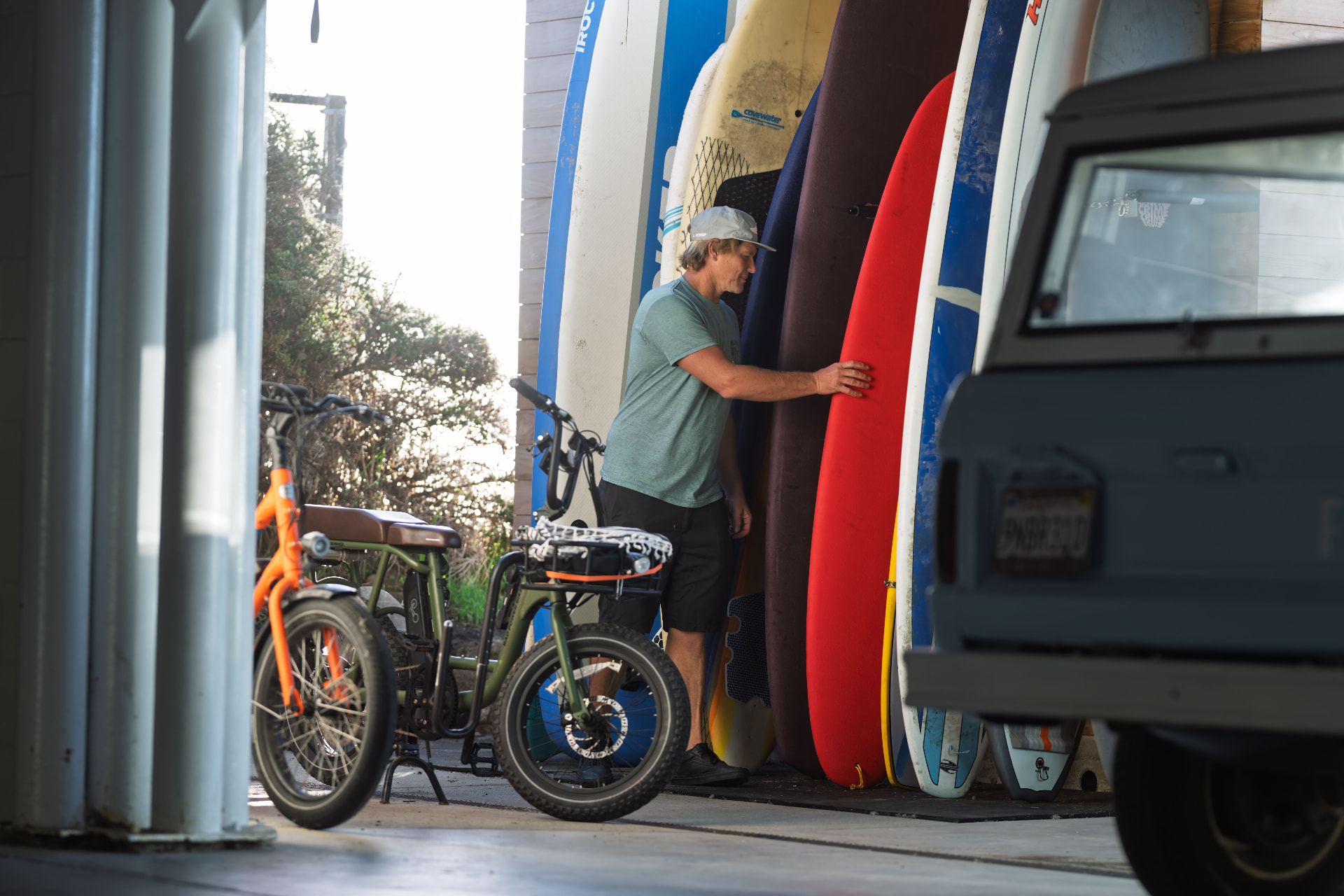 Guest e-bikes and surfboards in the shared storage