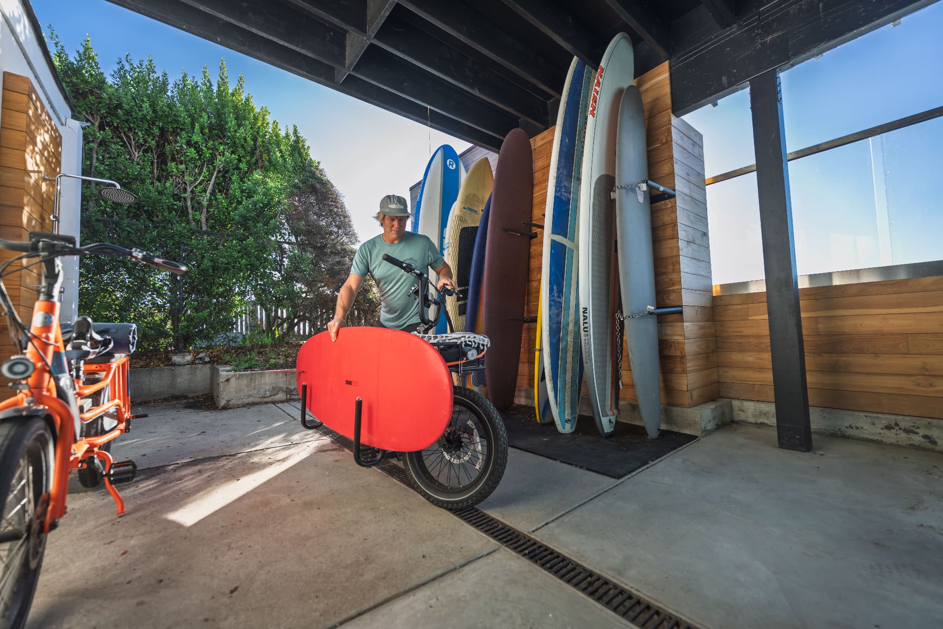 Loading a surfboard onto an e-bike rack