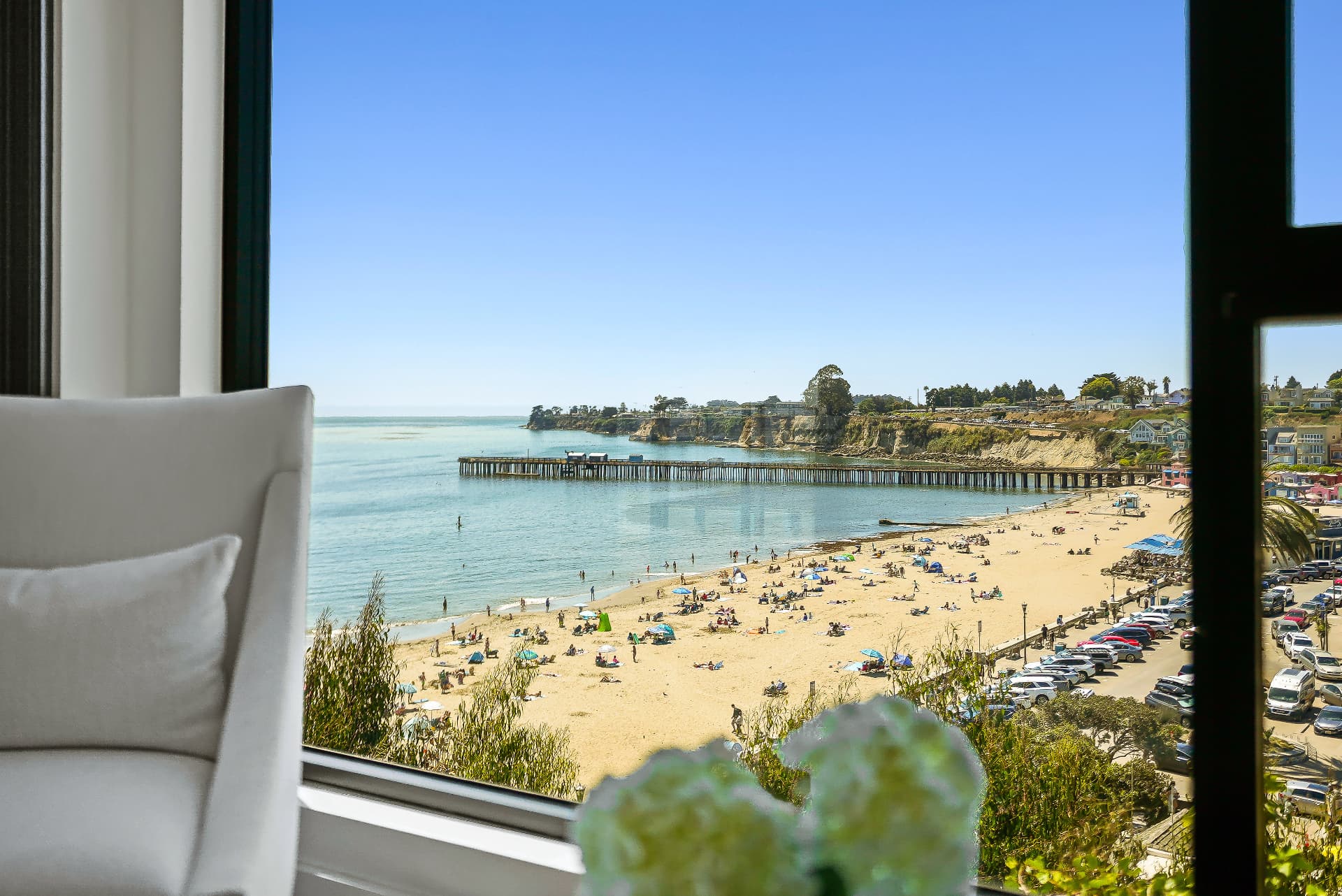 The beach framed by a living-room window
